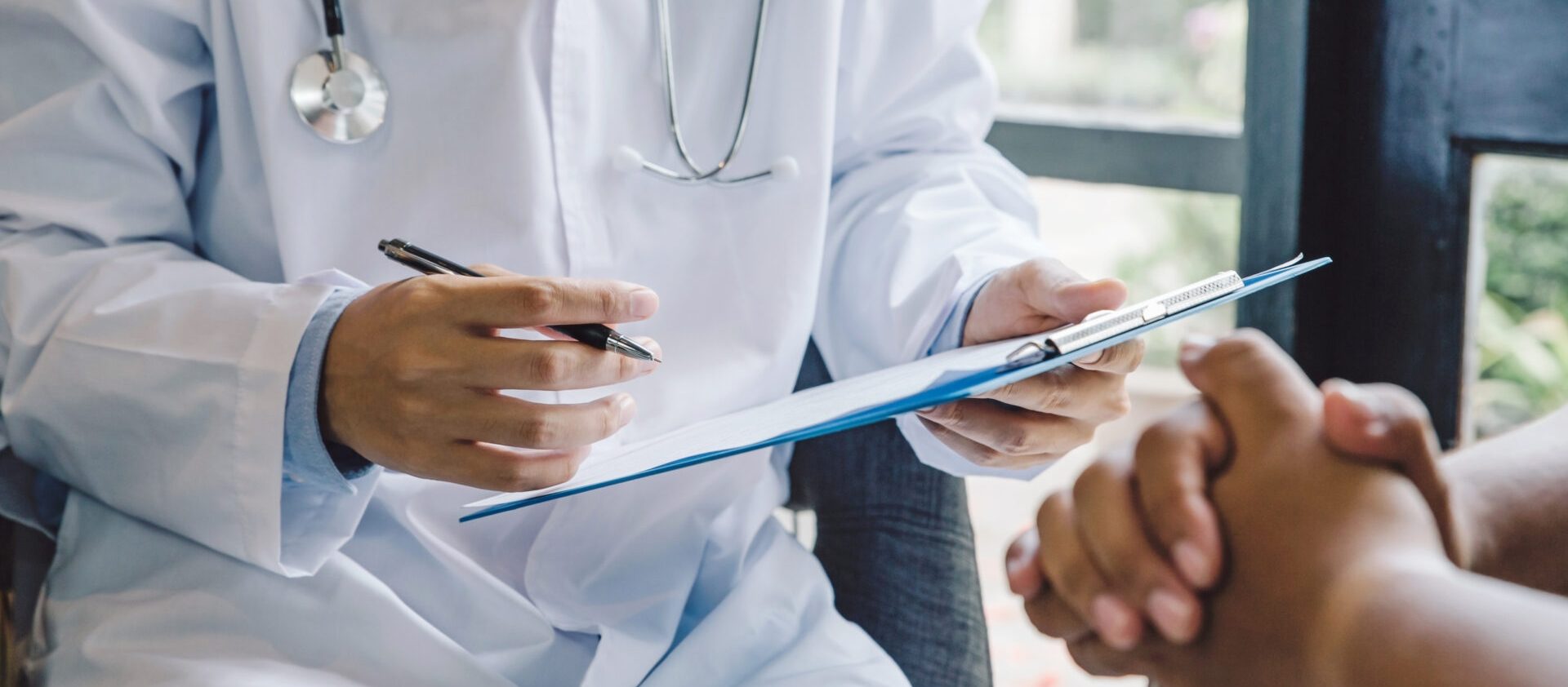 What to Expect at Your First Neurologist Appointment and How to Prepare 2 Doctor with paperwork | Seizures Center location | Neurology | Seizure Treatment